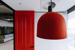 meeting room with red door and red light