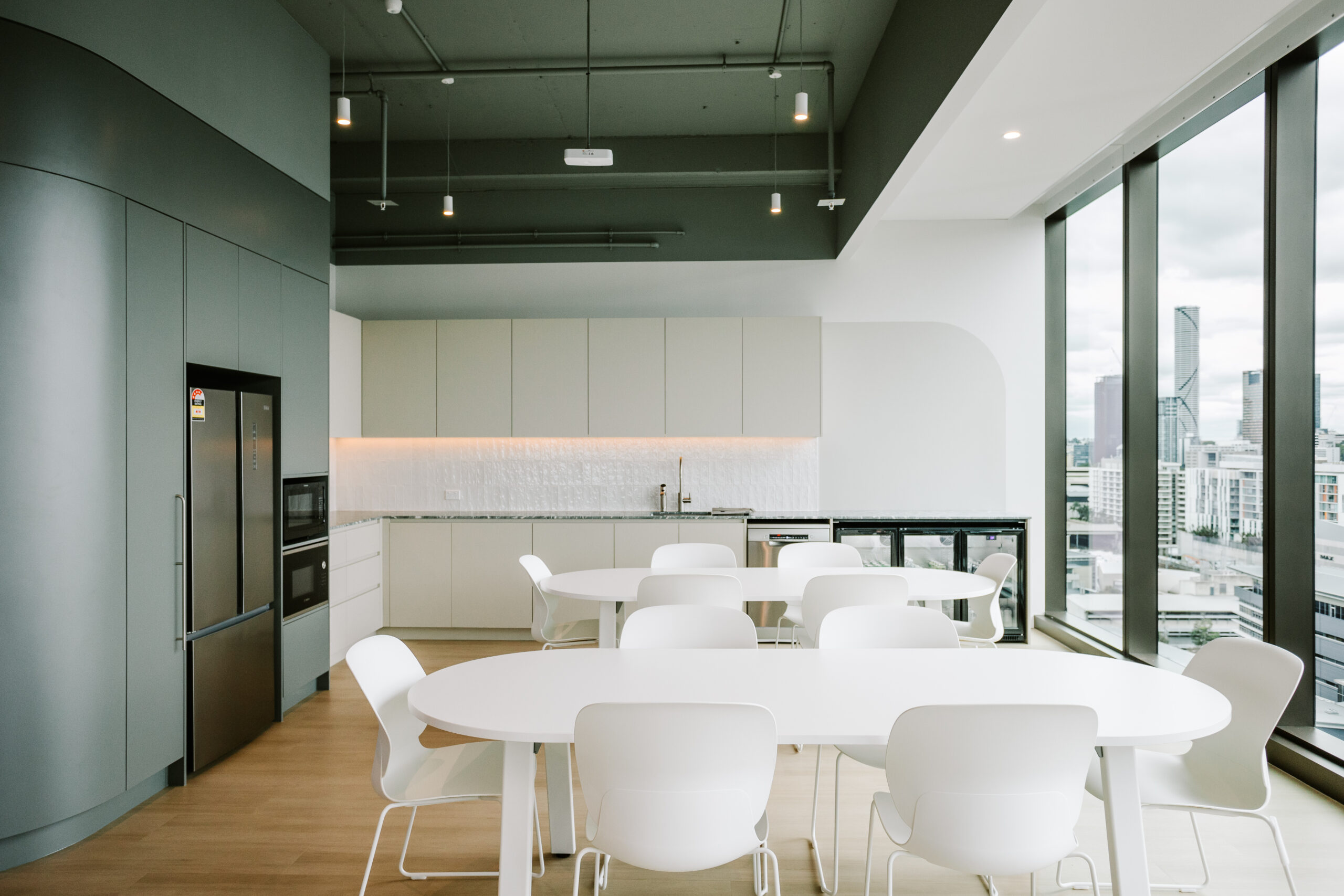 Spacious open-plan kitchen and dining area with city views at the Children’s Hospital Foundation office